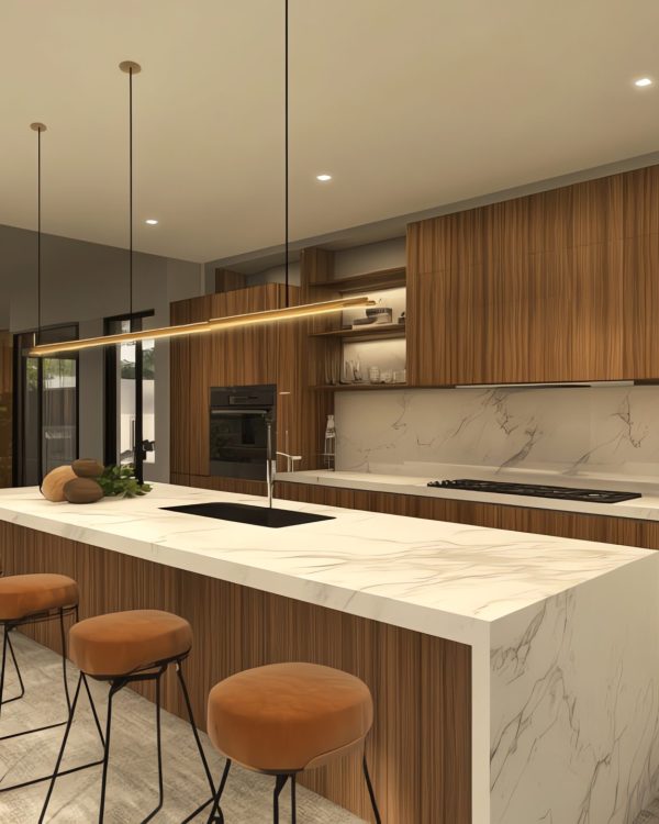 Modern kitchen with white marble countertops, wood cabinets, and a large island with bar stools.